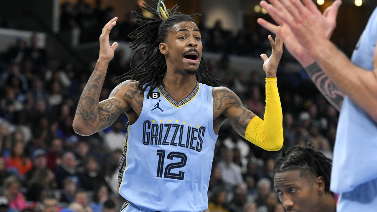 Memphis Grizzlies guard Ja Morant (12) reacts in the first half of an NBA basketball game against t...