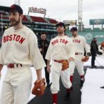 
              Boston Bruins players, from left, Linus Ullmark, Jeremy Swayman, A.J. Greer and Charlie McAvoy walk off the field in vintage Boston Red Sox uniforms before the NHL Winter Classic hockey game against the Pittsburgh Penguins, Monday, Jan. 2, 2023, at Fenway Park in Boston. (AP Photo/Michael Dwyer)
            