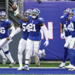 
              New York Giants' Landon Collins (21) celebrates with teammates after returning an interception for a touchdown during the first half of an NFL football game against the Indianapolis Colts, Sunday, Jan. 1, 2023, in East Rutherford, N.J. (AP Photo/Seth Wenig)
            