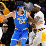 UCLA's Jamie Jaquez Jr. (24) is defended by Arizona State's Devan Cambridge (35) during the second half of an NCAA college basketball game Thursday, Jan. 19, 2023, in Tempe, Ariz. UCLA won 74-62. (AP Photo/Darryl Webb)