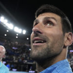 Novak Djokovic of Serbia reacts as he leaves Rod Laver Arena after defeating Andrey Rublev of Russia in their quarterfinal match at the Australian Open tennis championship in Melbourne, Australia, Wednesday, Jan. 25, 2023. (AP Photo/Ng Han Guan)