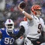 Cincinnati Bengals quarterback Joe Burrow (9) passes against the Buffalo Bills during the second quarter of an NFL division round football game, Sunday, Jan. 22, 2023, in Orchard Park, N.Y. (AP Photo/Adrian Kraus)