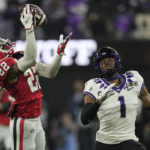 Georgia defensive back Javon Bullard (22) intercepts the ball intended for TCU wide receiver Quentin Johnston (1) during the first half of the national championship NCAA College Football Playoff game, Monday, Jan. 9, 2023, in Inglewood, Calif. (AP Photo/Mark J. Terrill)
