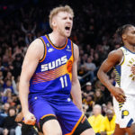 Phoenix Suns' Jock Landale (11) celebrate after a dunk against the Indiana Pacers during the second half of an NBA basketball game in Phoenix, Saturday, Jan. 21, 2023. (AP Photo/Darryl Webb)