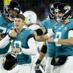 Jacksonville Jaguars place kicker Riley Patterson (10) and his team celebrate his game-winning field goal against the Los Angeles Chargers during the second of an NFL wild-card football game, Saturday, Jan. 14, 2023, in Jacksonville, Fla. Jacksonville Jaguars won 31-30. (AP Photo/John Raoux)