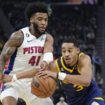 Golden State Warriors guard Jordan Poole (3) drives to the basket against Detroit Pistons forward Saddiq Bey (41) during the first half of an NBA basketball game in San Francisco, Wednesday, Jan. 4, 2023. (AP Photo/Jeff Chiu)