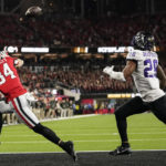 Georgia wide receiver Ladd McConkey (84) prepares to make a touchdown catch against TCU safety Millard Bradford (28) during the second half of the national championship NCAA College Football Playoff game, Monday, Jan. 9, 2023, in Inglewood, Calif. (AP Photo/Ashley Landis)