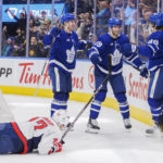 Toronto Maple Leafs right wing William Nylander (88) celebrates after his goal with teammates Rasmus Sandin (38) and Calle Jarnkrok (19) as Washington Capitals defenseman Martin Fehervary (42) looks on during second-period NHL hockey game in Toronto, Ontario, Sunday, Jan. 29, 2023. (Cole Burston/The Canadian Press via AP)
