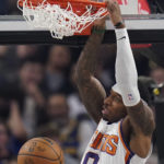 
              Phoenix Suns forward Torrey Craig dunks against the Golden State Warriors during the first half of an NBA basketball game in San Francisco, Tuesday, Jan. 10, 2023. (AP Photo/Godofredo A. Vásquez)
            