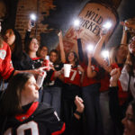 
              Georgia students celebrate as they watch television coverage of the NCAA College Football Playoff national championship game against TCU, Monday, Jan. 9, 2023, in Athens, Ga. (AP Photo/Alex Slitz)
            