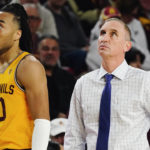 Arizona State coach Bobby Hurley, right, and guard Frankie Collins pause near the team bench during the second half of the team's NCAA college basketball game against Southern California in Tempe, Ariz., Saturday, Jan. 21, 2023. (AP Photo/Ross D. Franklin)