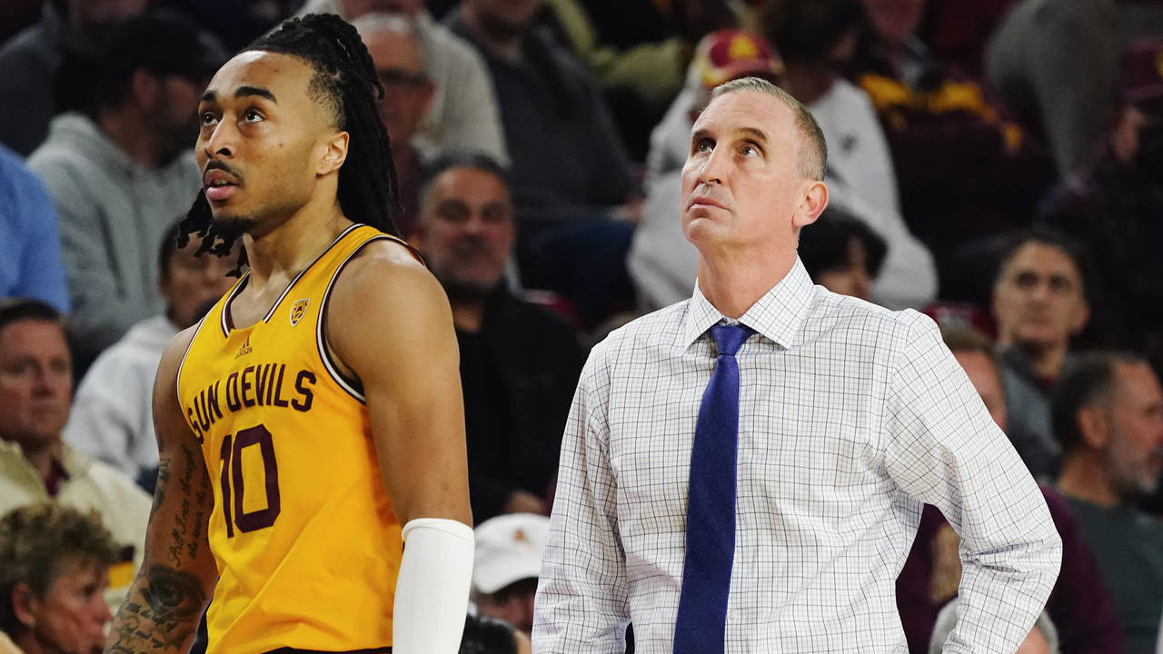 Arizona State coach Bobby Hurley, right, and guard Frankie Collins pause near the team bench during...