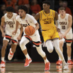 Oregon State guard Jordan Pope, front, drives upcourt past Arizona State forward Alonzo Gaffney (32) during the first half of an NCAA college basketball game in Corvallis, Ore., Saturday, Jan. 14, 2023. (AP Photo/Amanda Loman)