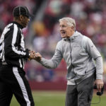 Seattle Seahawks head coach Pete Carroll reacts toward line judge Julian Mapp during the second half of an NFL wild card playoff football game between the San Francisco 49ers and the Seahawks in Santa Clara, Calif., Saturday, Jan. 14, 2023. (AP Photo/Godofredo A. Vásquez)