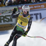 
              Italy's Marta Bassino celebrates at the finish area of an alpine ski, women's World Cup super-G, in Cortina d'Ampezzo, Italy, Sunday, Jan. 22, 2023. (AP Photo/Alessandro Trovati)
            