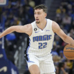 
              Orlando Magic forward Franz Wagner (22) drives to the basket against the Golden State Warriors during the first half of an NBA basketball game in San Francisco, Saturday, Jan. 7, 2023. (AP Photo/Jeff Chiu)
            