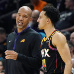 Phoenix Suns coach Monty Williams talks with guard Landry Shamet during the second half of the team's NBA basketball game against the Miami Heat in Phoenix, Friday, Jan. 6, 2023. The Heat won 104-96. (AP Photo/Ross D. Franklin)