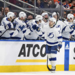 Tampa Bay Lightning left wing Brandon Hagel (38) is congratulated for a goal against the Edmonton Oilers during the second period of an NHL hockey game Thursday, Jan. 19, 2023, in Edmonton, Alberta. (Jason Franson/The Canadian Press via AP)