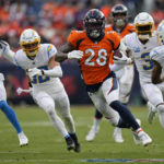 Denver Broncos running back Latavius Murray (28) runs against the Los Angeles Chargers during the first half of an NFL football game in Denver, Sunday, Jan. 8, 2023. (AP Photo/Jack Dempsey)