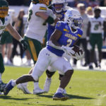 
              CORRECTS TO NORTH DAKOTA STATE NOT NORTH DAKOTA - South Dakota State running back Amar Johnson (3) finds room to run on his way to scoring a touchdown during the first half of the FCS Championship NCAA college football game against the North Dakota State, Sunday, Jan. 8, 2023, in Frisco, Texas. (AP Photo/LM Otero)
            