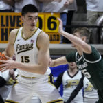 
              Michigan State center Carson Cooper (15) defends Purdue center Zach Edey (15) during the first half of an NCAA college basketball game in West Lafayette, Ind., Sunday, Jan. 29, 2023. (AP Photo/Michael Conroy)
            