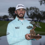 
              Max Homa holds the trophy after winning the Farmers Insurance Open golf tournament, Saturday, Jan. 28, 2023, in San Diego. (AP Photo/Gregory Bull)
            
