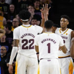 UCLA's Dylan Andrews, left, watches as Arizona State's Warren Washington (22), Luther Muhammad ((1) and Alonzo Gaffey celebrate during the first half of an NCAA college basketball game Thursday, Jan. 19, 2023, in Tempe, Ariz. (AP Photo/Darryl Webb)