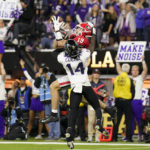 Georgia tight end Brock Bowers (19) makes a touchdown catch against TCU safety Abraham Camara (14) during the second half of the national championship NCAA College Football Playoff game, Monday, Jan. 9, 2023, in Inglewood, Calif. (AP Photo/Ashley Landis)