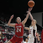 Utah guard Kennady McQueen (24) and Stanford forward Cameron Brink (22) reach for the ball during the first half of an NCAA college basketball game in Stanford, Calif., Friday, Jan. 20, 2023. (AP Photo/Godofredo A. Vásquez)