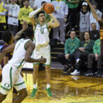 Oregon guard Will Richardson (0) shoots over Arizona State forward Warren Washington (22) during the first half of an NCAA college basketball game Thursday, Jan. 12, 2023, in Eugene, Ore. (AP Photo/Andy Nelson)