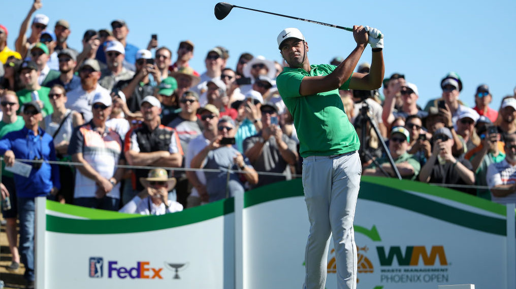 Tony Finau plays his shot from the tenth tee during the third round of the Waste Management Phoenix...