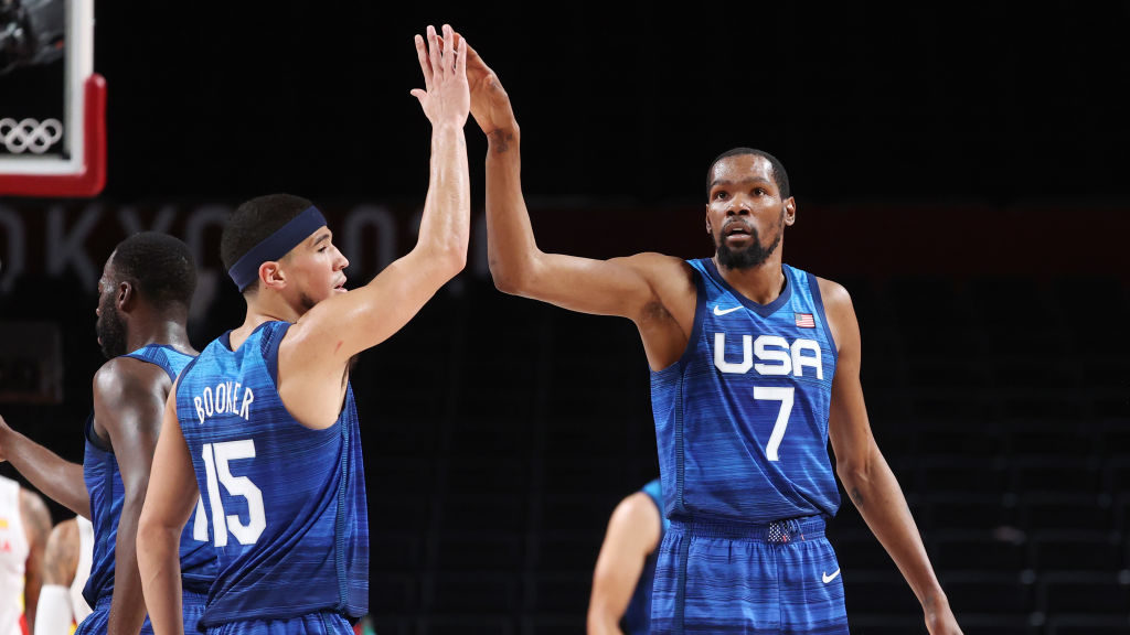 Kevin Durant #7 and Devin Booker #15 of Team United States celebrate a play against Spain during th...