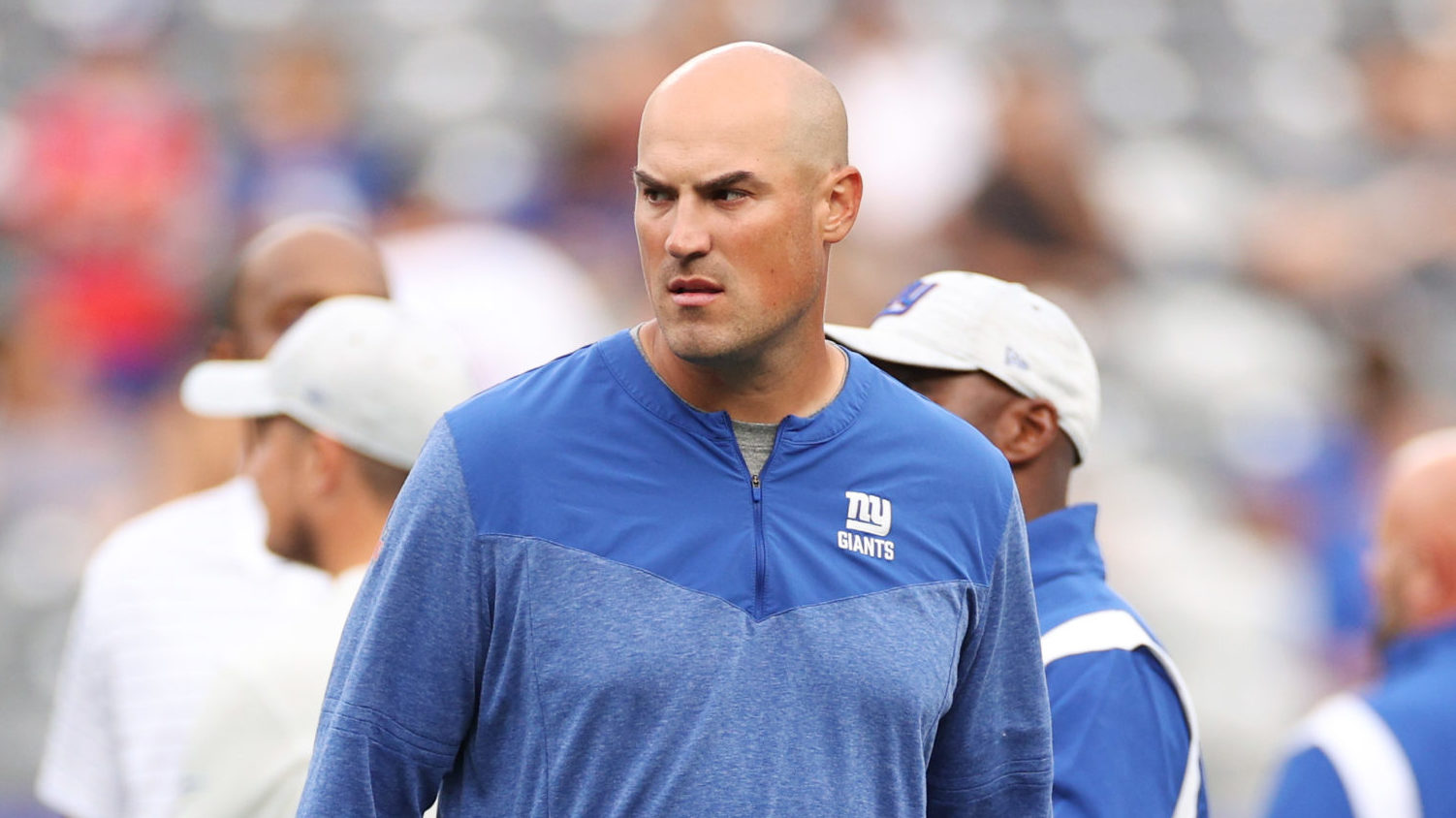 Offensive coordinator Mike Kafka of the New York Giants looks on during warmups of a preseason game...