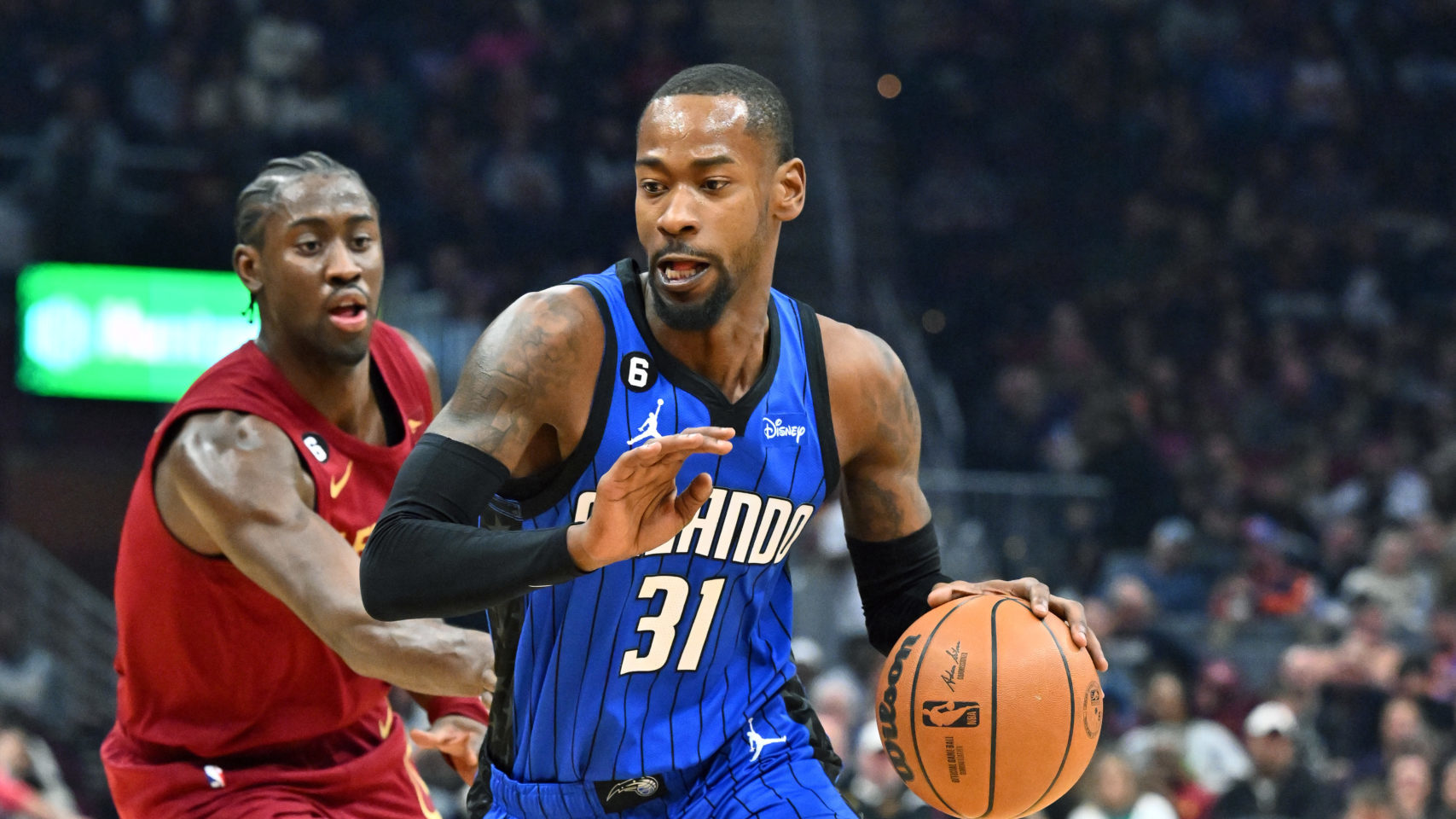 Terrence Ross #31 of the Orlando Magic drives to the basket past Caris LeVert #3 of the Cleveland C...