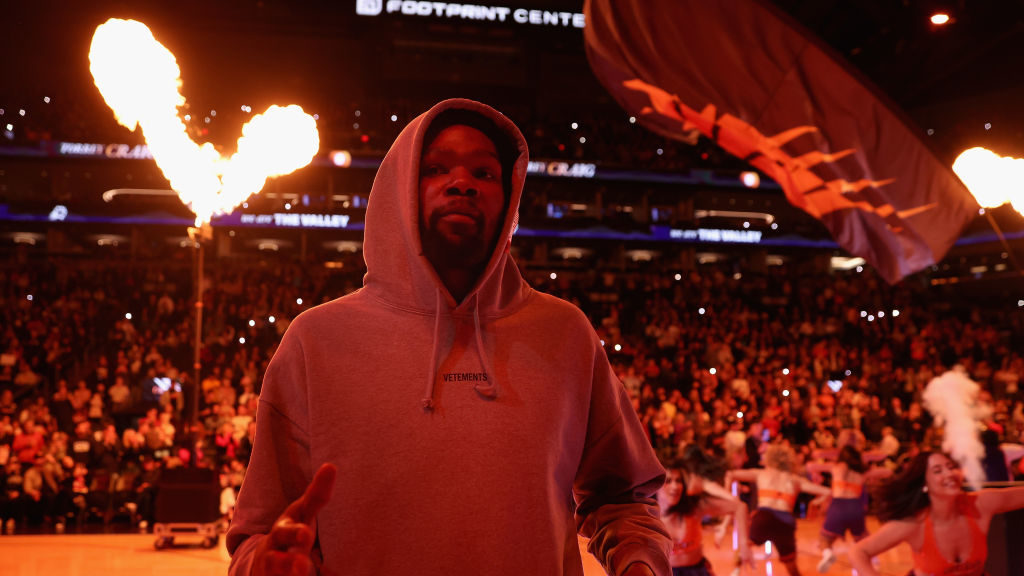 Kevin Durant #35 of the Phoenix Suns walks onto the court before the first half of the NBA game aga...
