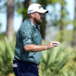 
              Shane Lowry, of Ireland, acknowledges the gallery after putting on the eighth green during the third round of the Honda Classic golf tournament, Saturday, Feb. 25, 2023, in Palm Beach Gardens, Fla. (AP Photo/Lynne Sladky)
            