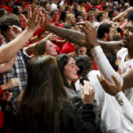 
              Maryland guard Hakim Hart (13) high fives fans following an NCAA college basketball game against Northwestern, Sunday, Feb. 26, 2023, in College Park, Md. Maryland won 75-59. (AP Photo/Julia Nikhinson)
            