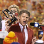 
              FILE - Kansas City Chiefs owner Clark Hunt celebrates with the Lamar Hunt Trophy after the AFC championship NFL football game against the Buffalo Bills, Sunday, Jan. 24, 2021, in Kansas City, Mo. The Chiefs won 38-24. Clark Hunt proudly held aloft the AFC championship trophy bearing his father's name, the one signifying that his Kansas City Chiefs were headed back to the Super Bowl for the third time in four years, and reflected upon a time not so long ago when such success seemed so elusive. (AP Photo/Reed Hoffmann, File)
            