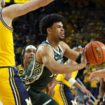 
              Michigan State forward Malik Hall passes during the first half of an NCAA college basketball game against Michigan, Saturday, Feb. 18, 2023, in Ann Arbor, Mich. (AP Photo/Carlos Osorio)
            