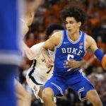
              Duke's Tyrese Proctor (5) defends the ball against Virginia during the first half of an NCAA college basketball game in Charlottesville, Va., Saturday, Feb. 11, 2023. (AP Photo/Mike Kropf)
            