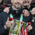 
              Manchester United's head coach Erik ten Hag poses with the trophy after the English League Cup final soccer match between Manchester United and Newcastle United at Wembley Stadium in London, Sunday, Feb. 26, 2023. (AP Photo/Alastair Grant)
            
