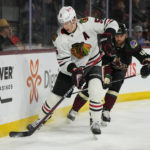Chicago Blackhawks defenseman Connor Murphy skates away from Arizona Coyotes right wing Zack Kassian in the first period during an NHL hockey game, Tuesday, Feb. 28, 2023, in Tempe, Ariz. (AP Photo/Rick Scuteri)