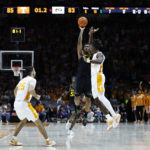 Missouri guard DeAndre Gholston (4) takes a last-second 3-point shot over Tennessee guard Jahmai Mashack, right, during the second half of an NCAA college basketball game Saturday, Feb. 11, 2023, in Knoxville, Tenn. (AP Photo/Wade Payne)