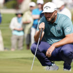 
              Jon Rahm reads his putt on the second hole during the third round of the Phoenix Open golf tournament Saturday Feb. 11, 2023, in Scottsdale, Ariz. (AP Photo/Darryl Webb)
            