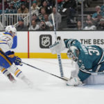 San Jose Sharks goaltender Kaapo Kahkonen (36) defends against a shot attempt by Buffalo Sabres right wing JJ Peterka (77) during the second period of an NHL hockey game in San Jose, Calif., Saturday, Feb. 18, 2023. (AP Photo/Jeff Chiu)
