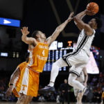
              Vanderbilt guard Tyrin Lawrence shoots over Tennessee guard Tyreke Key (4) during the second half of an NCAA college basketball game Wednesday, Feb. 8, 2023, in Nashville, Tenn. (AP Photo/Wade Payne)
            