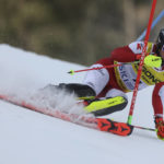 Austria's Manuel Feller speeds down the course during the men's World Championship slalom, in Courchevel, France, Sunday Feb. 19, 2023. (AP Photo/Alessandro Trovati)