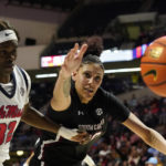 
              Mississippi center Rita Igbokwe (32) and South Carolina center Kamilla Cardoso, right, scramble for the ball during the second half of an NCAA college basketball game in Oxford, Miss., Sunday, Feb. 19, 2023. (AP Photo/Rogelio V. Solis)
            