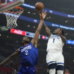 Minnesota Timberwolves guard Anthony Edwards (1) shoots over Los Angeles Clippers forward Kawhi Leonard (2) during the first half of an NBA basketball game Tuesday, Feb. 28, 2023, in Los Angeles. (AP Photo/Marcio Jose Sanchez)