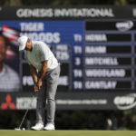 
              Tiger Woods putts on the eighth hole during the third round of the Genesis Invitational golf tournament at Riviera Country Club, Saturday, Feb. 18, 2023, in the Pacific Palisades area of Los Angeles. (AP Photo/Ryan Kang)
            